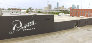 Printed Threads with the skyline of Fort Worth.