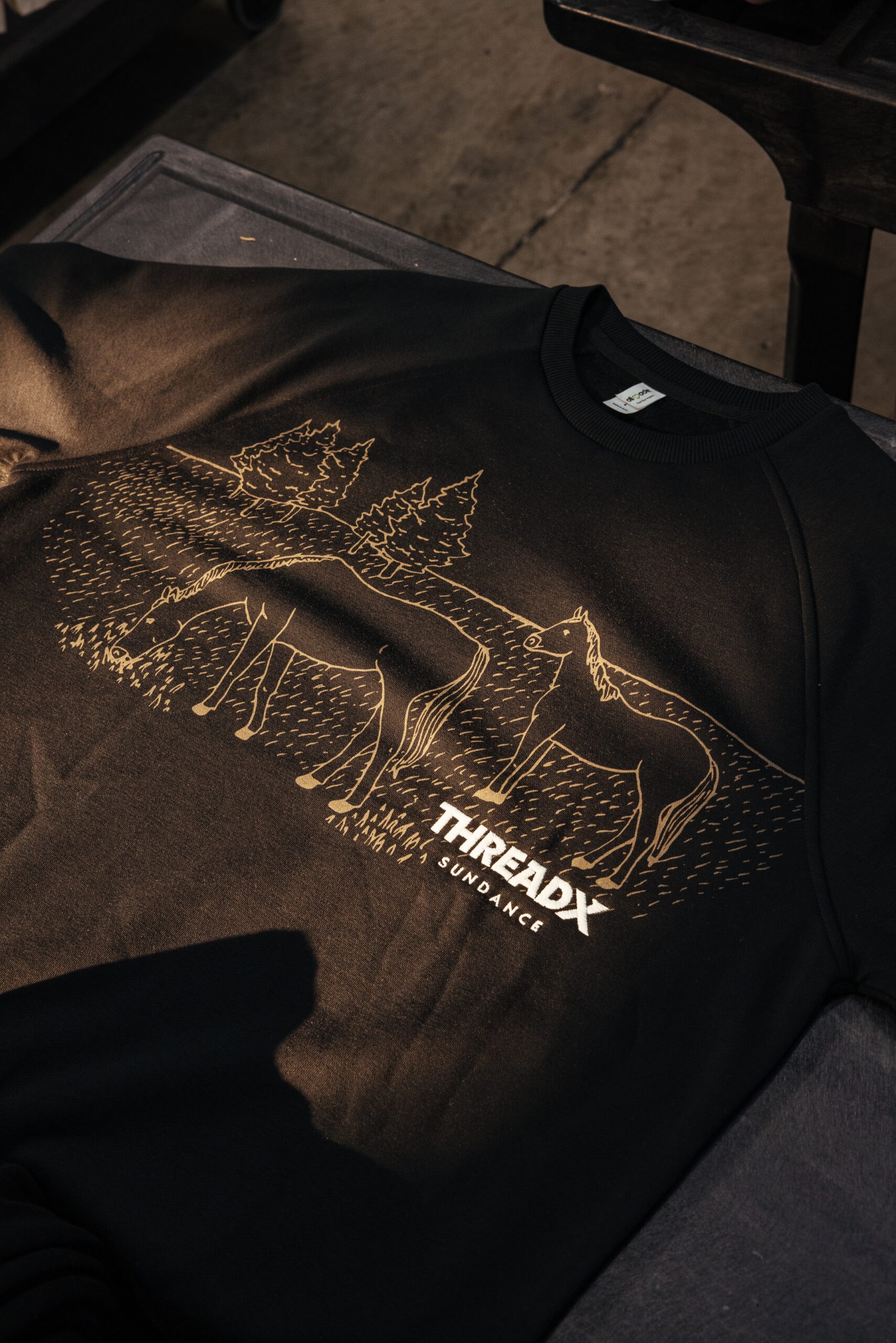 A garment showcasing both screen printing and embroidery.