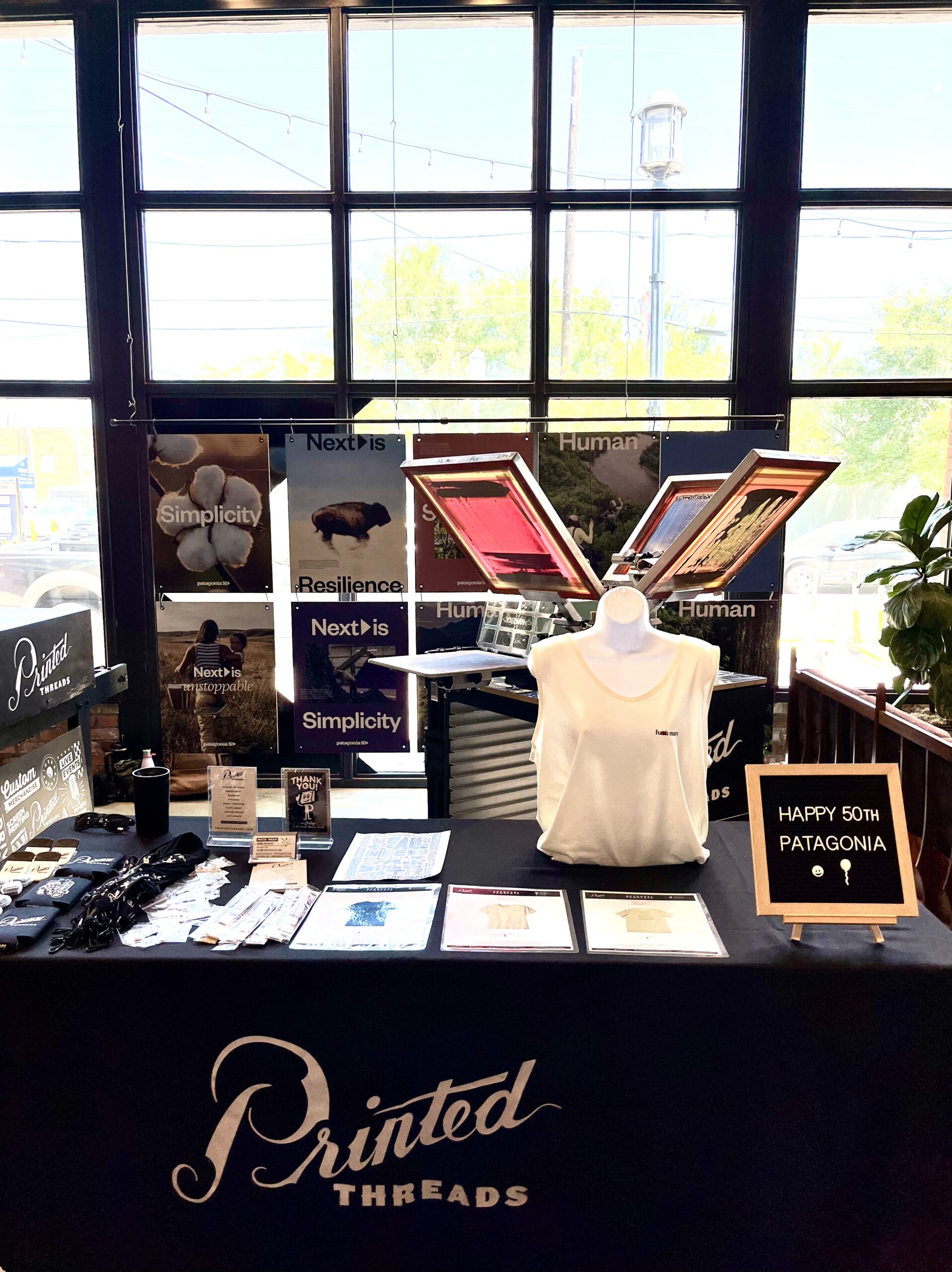 Printed Threads live screen printing for a trade show.